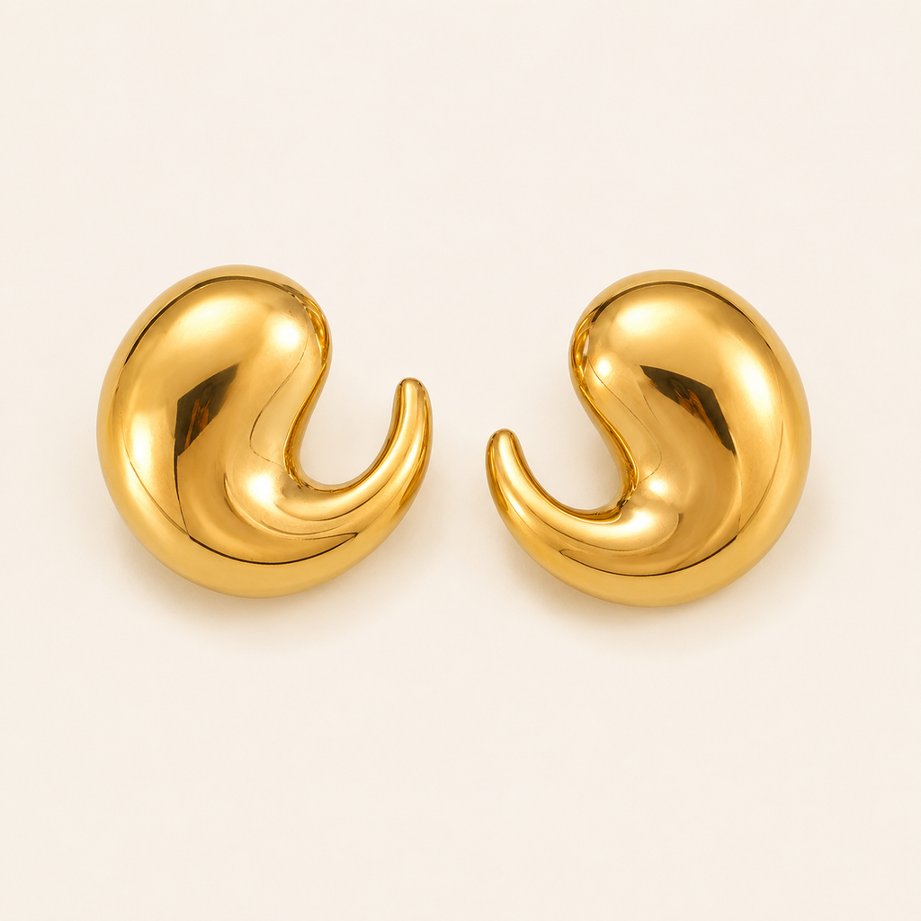 A pair of gold-toned, drop-shape stud earrings with a polished, reflective finish.