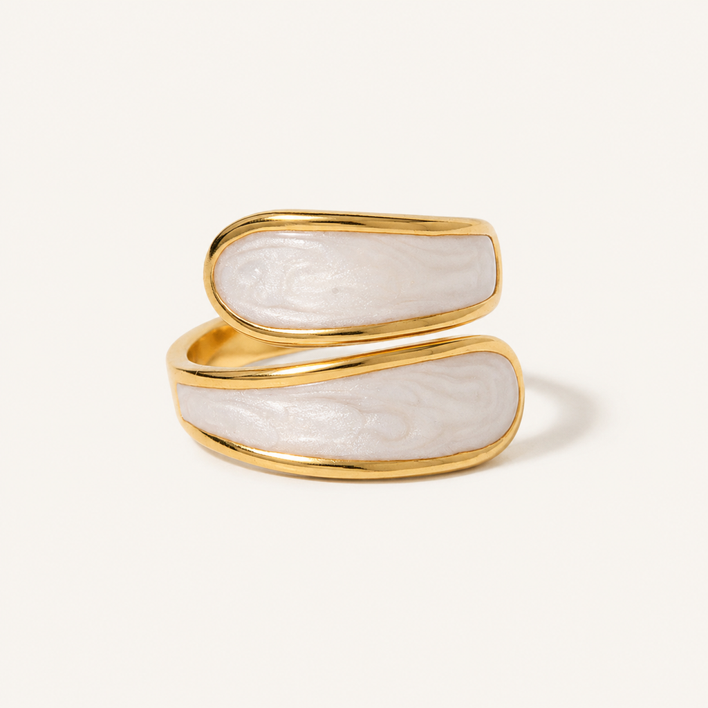A gold open ring featuring two horizontal oval sections with a white, marbled mother-of-pearl inlay.