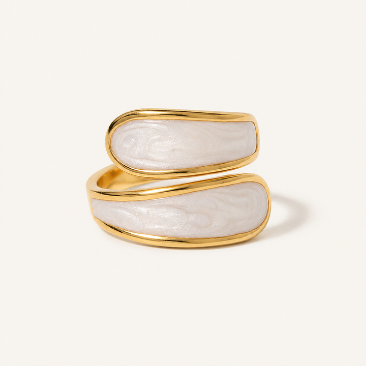 A gold open ring featuring two horizontal oval sections with a white, marbled mother-of-pearl inlay.