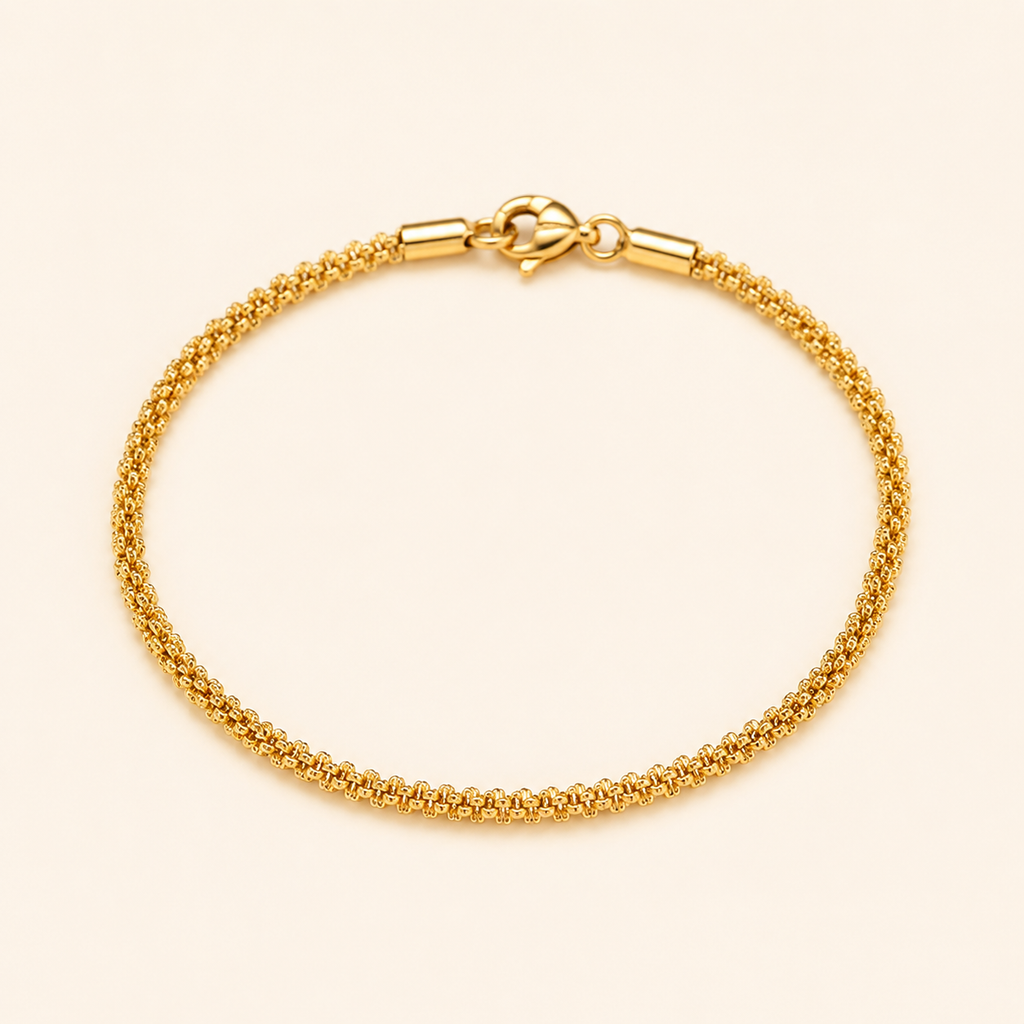 A gold chain bracelet with a textured woven-style design and a lobster clasp.