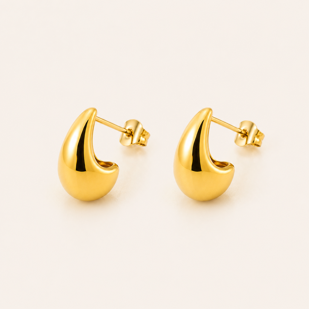 A pair of polished gold crescent-shaped hoop earrings with post-back closures.