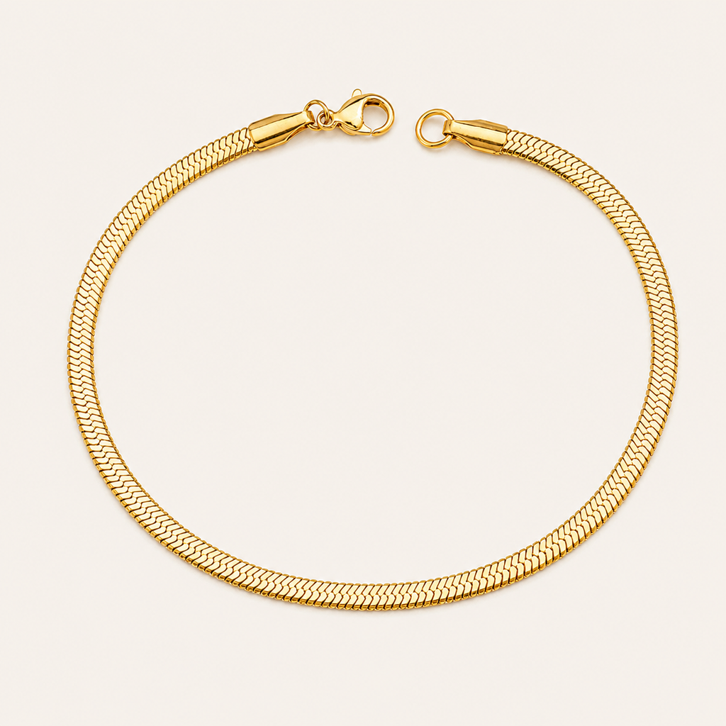 A gold-colored snake chain bracelet with a lobster clasp.