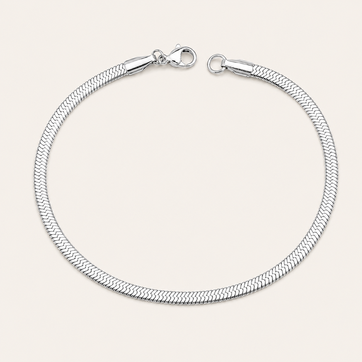 A silver-toned metal snake chain bracelet with a lobster clasp.