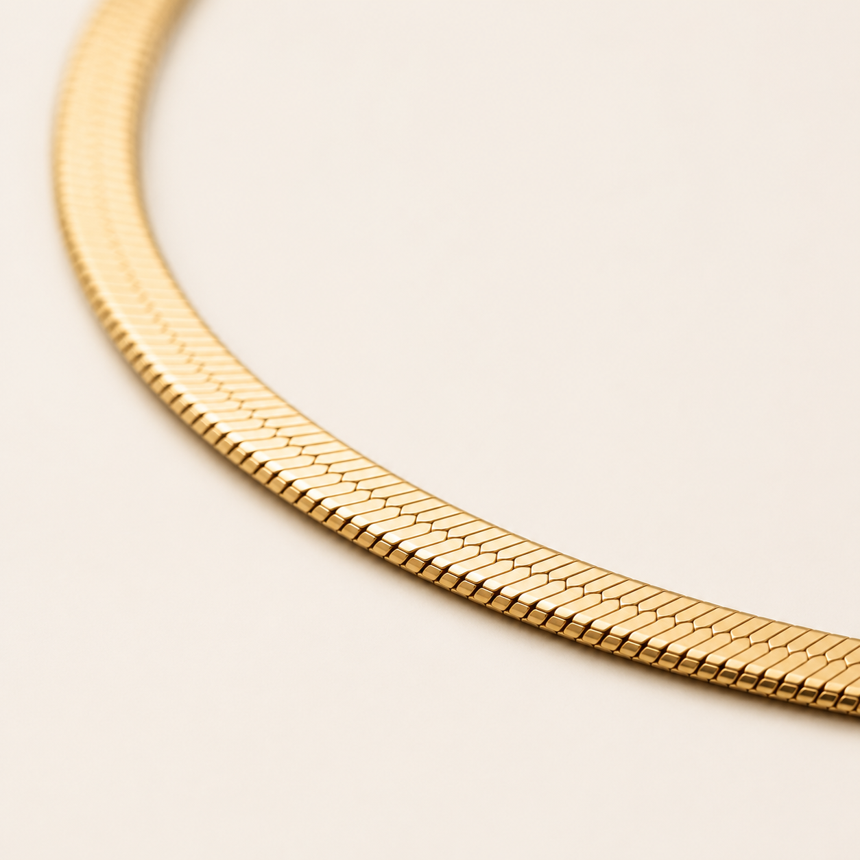 A close-up of a gold snake chain.