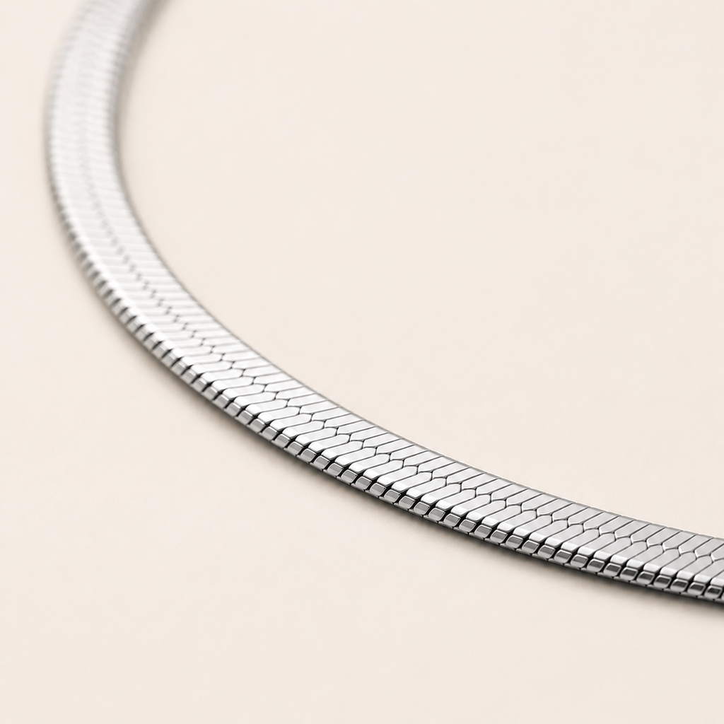 A close-up of a silver snake chain.