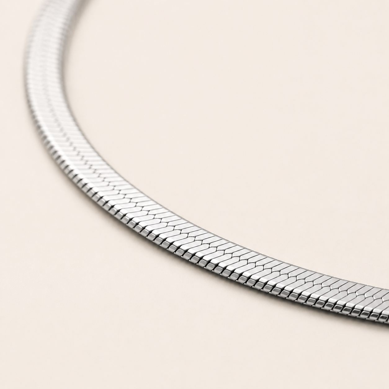 A close-up of a silver snake chain.