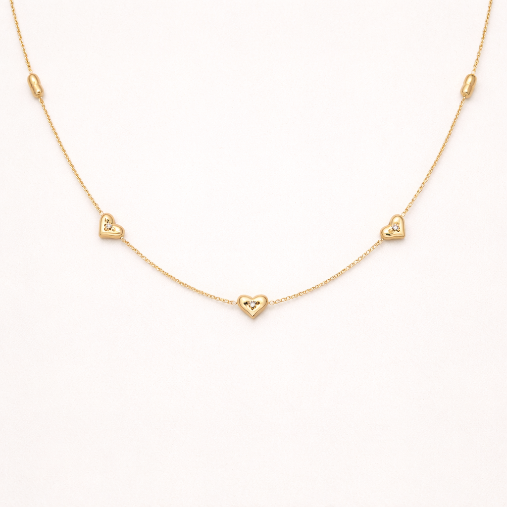 Amora gold necklace with small hearts design