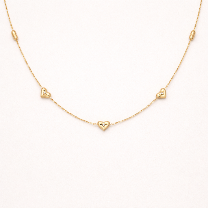 Amora gold necklace with small hearts design