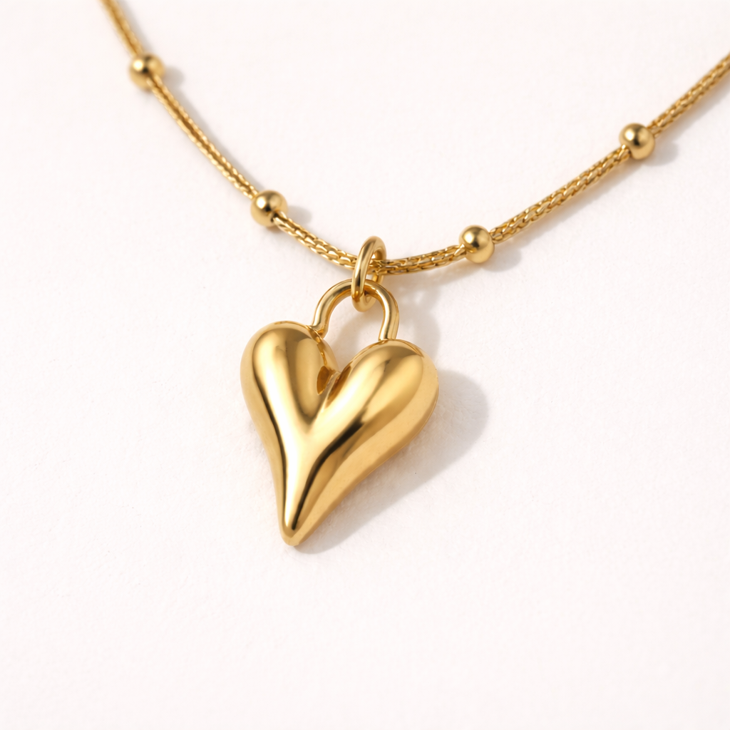 Close-up of gold heart-shaped pendant necklace