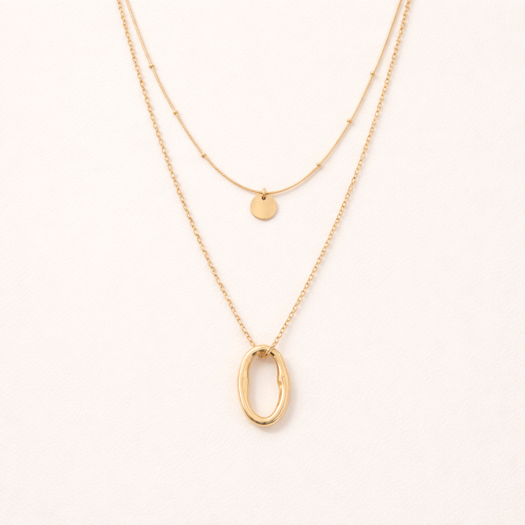 Oval pendant layered gold necklace