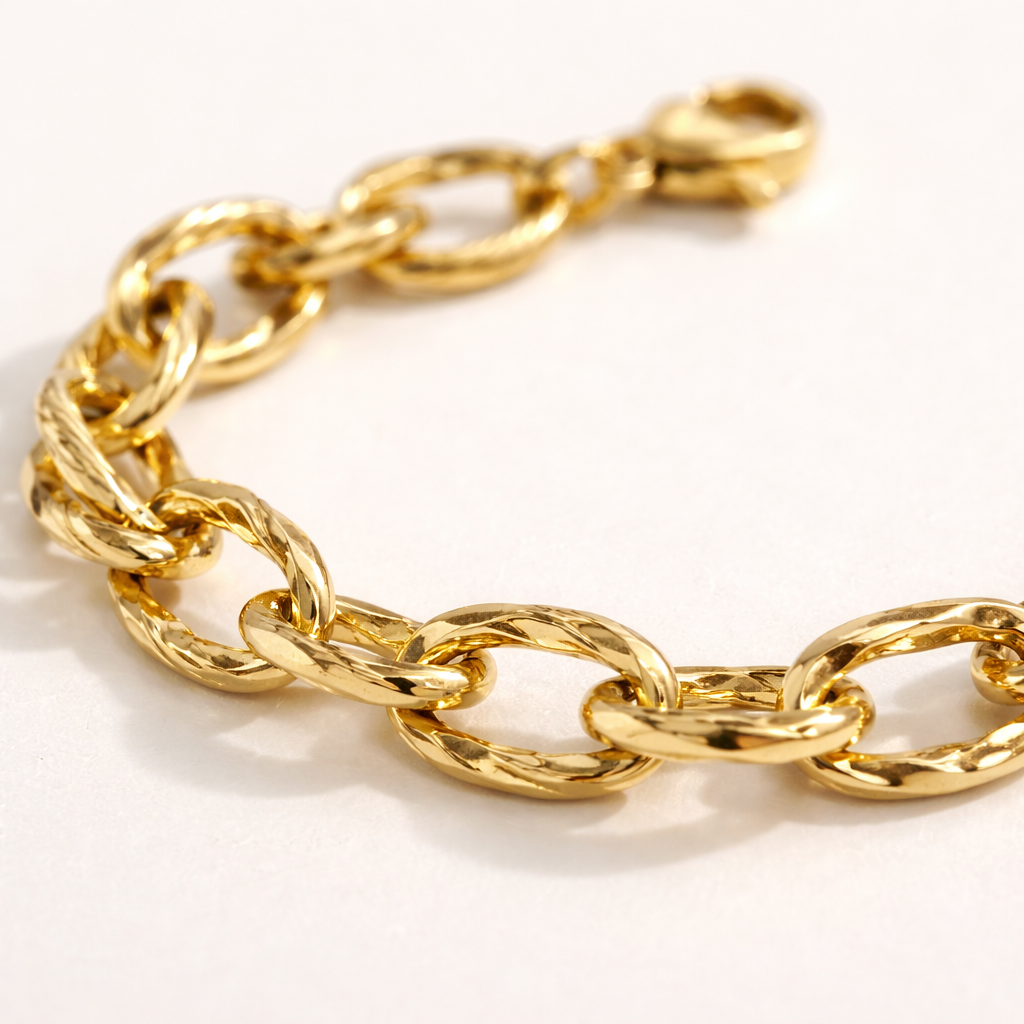 Gold chain bracelet on a white background